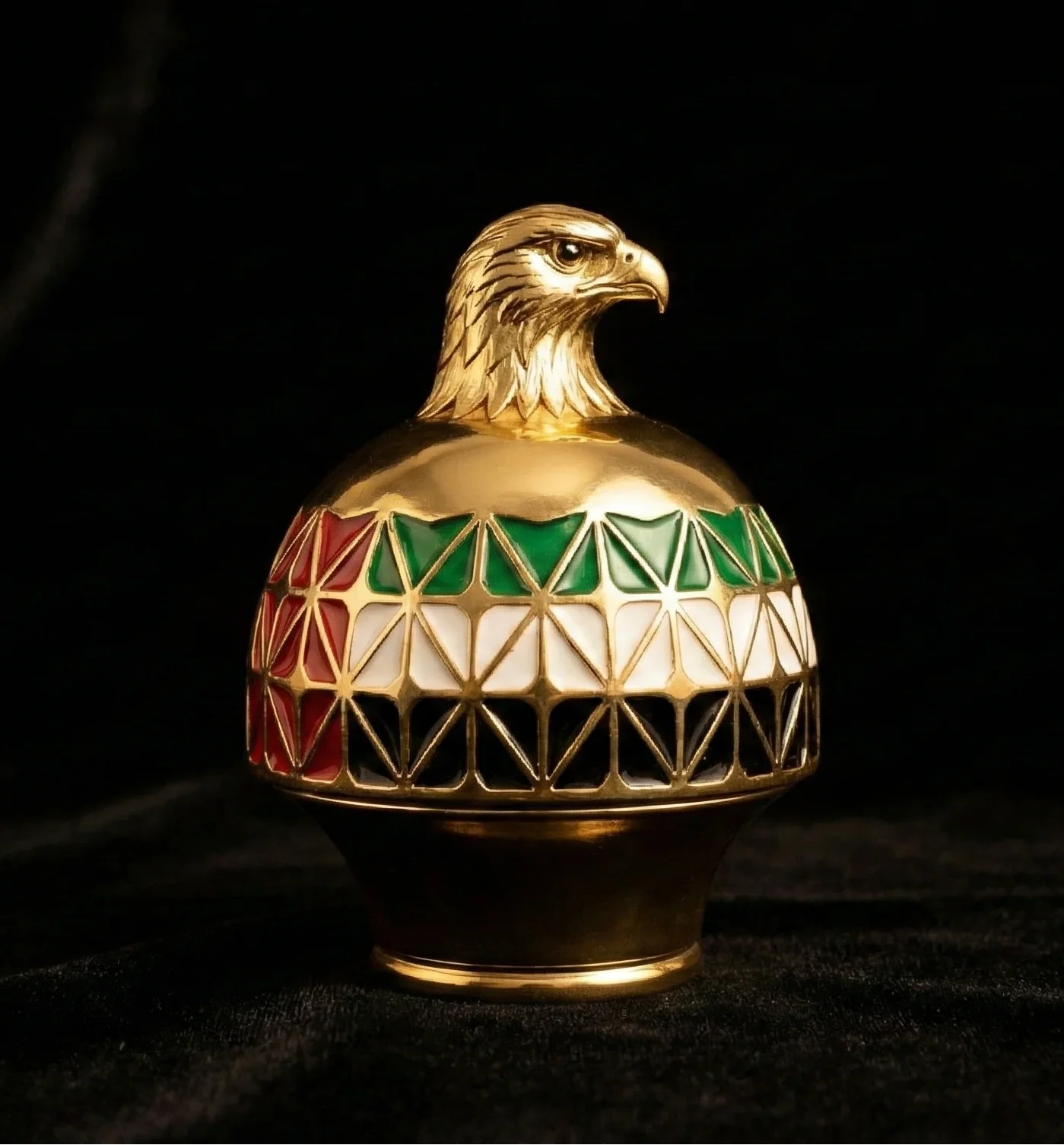 Gold UAE perfume cap with falcon head and UAE flag colors on black background